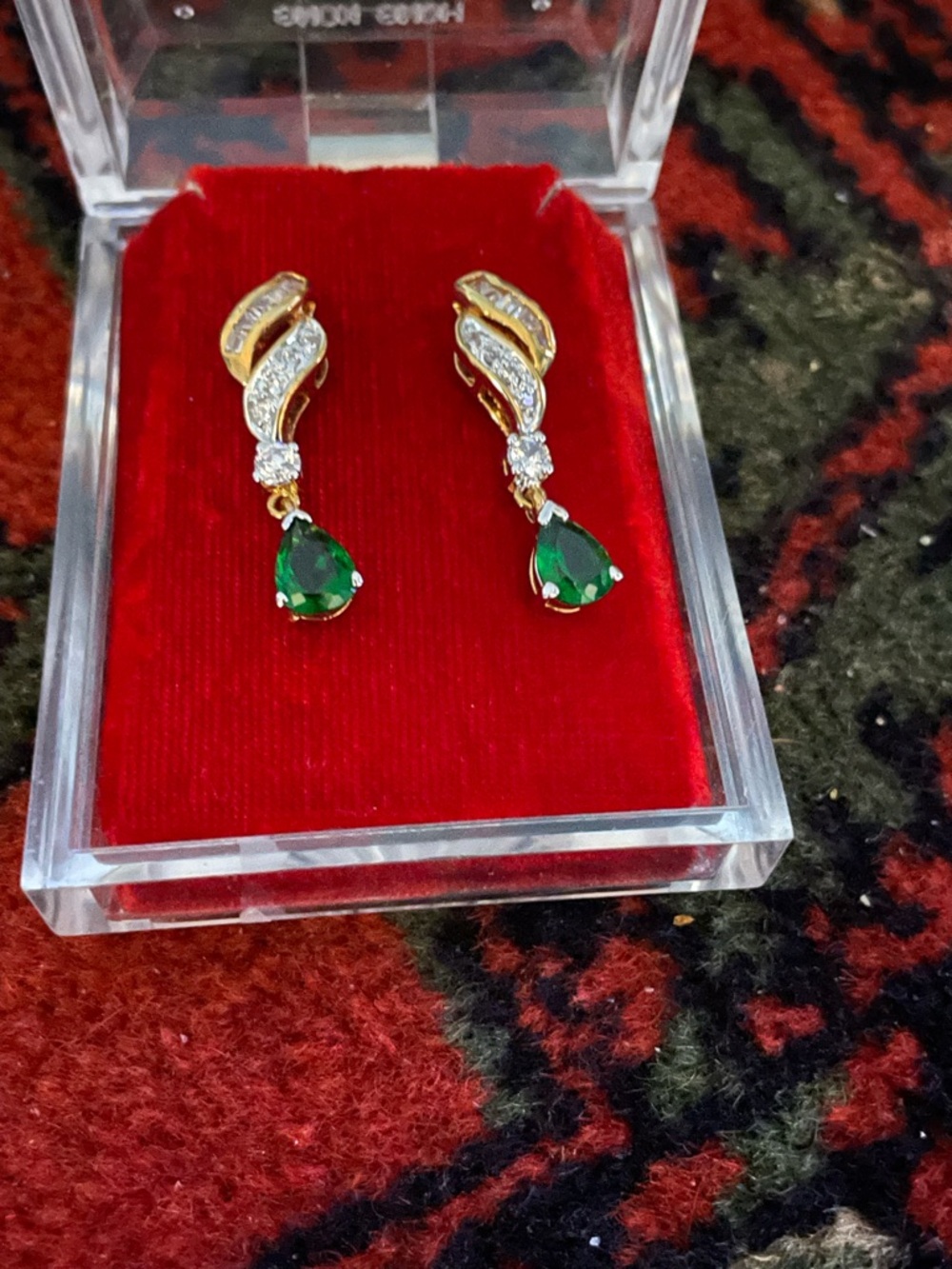 Beautiful pair of gold tone with white and green crystals